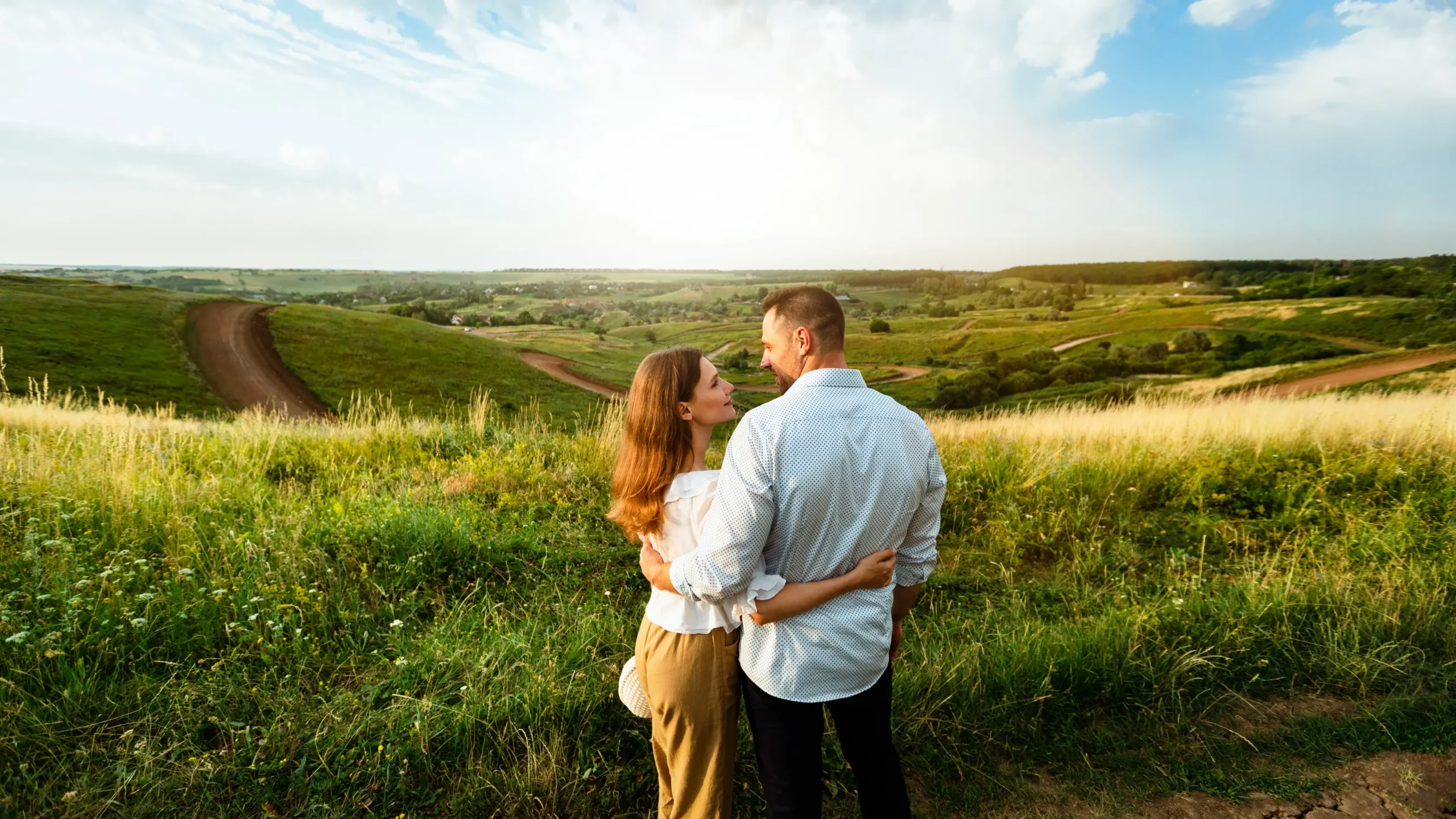 young couple enjoying landscape outdoors back vie 2025 03 18 17 39 42 utc scaled